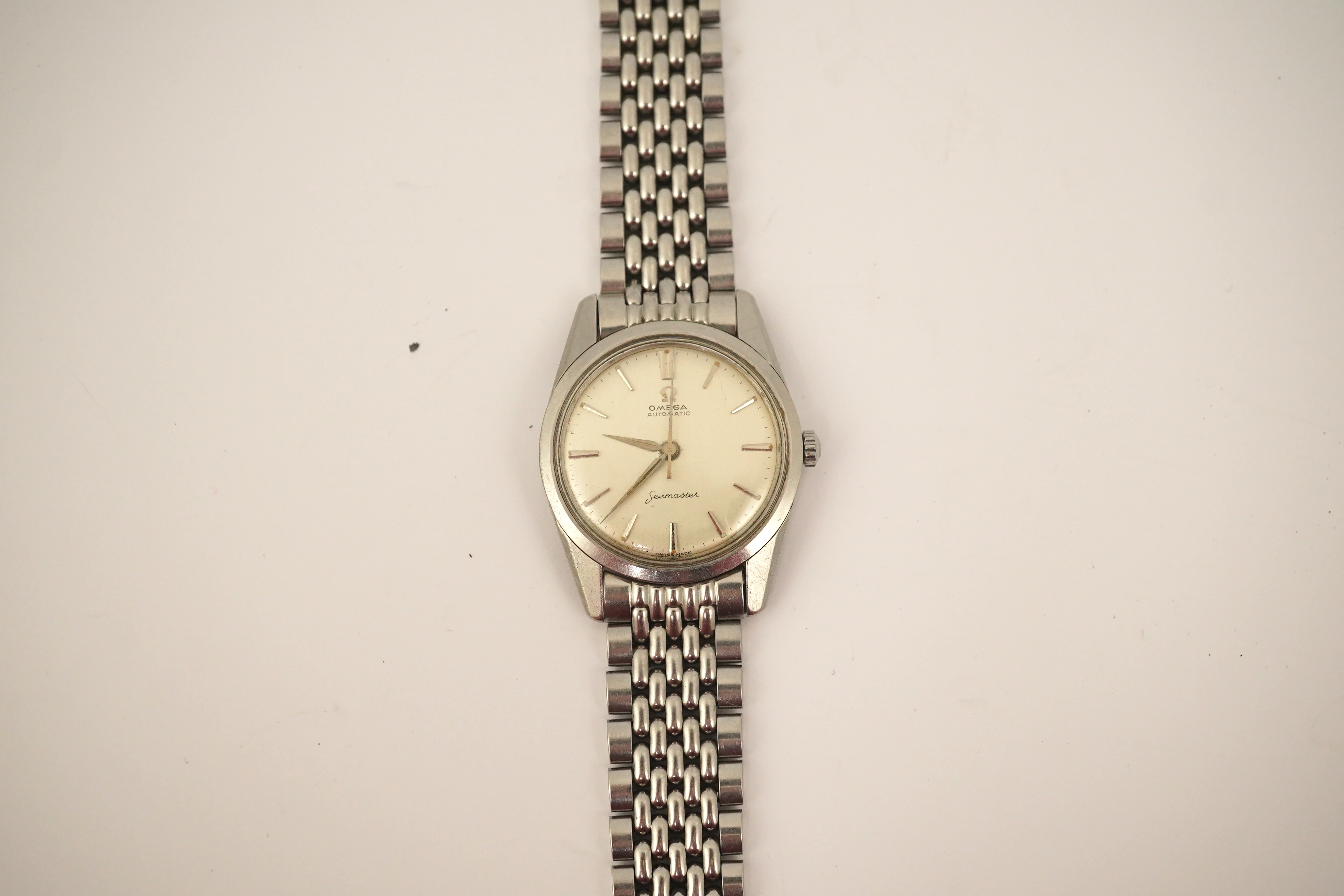 A gentleman's 1960's? stainless steel Omega Seamaster automatic wrist watch, on a stainless steel Omega bracelet